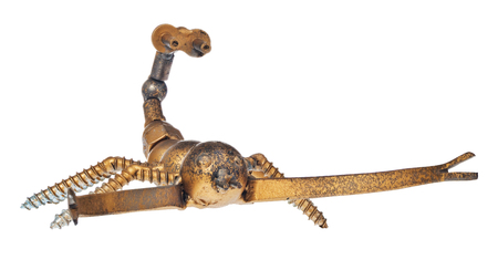 Handmade from car and motorcycle parts, scorpion. Arachnid made of motor bearing elements, drive chain, poultry, screws and other mechanical elements. Object isolated on a white background.の写真素材