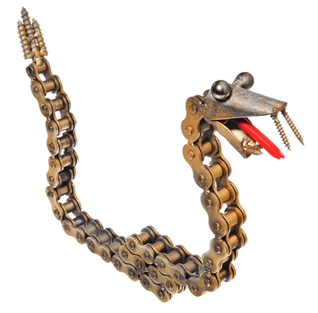 Handmade mechanic decorative snake. Reptile made of motorcycle parts: chain, bearings, screws. Artistic object painted on gold isolated on a white background.の写真素材