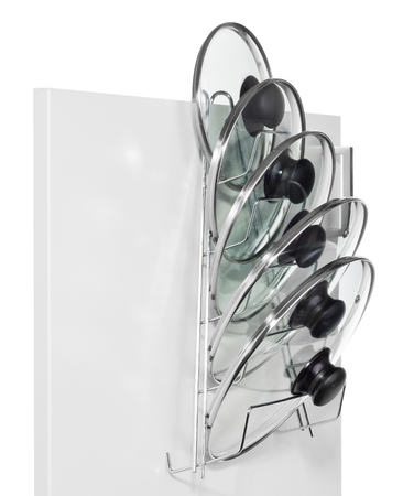 A hanger with glass lids for cooking pots hung on the door of a kitchen cupboard. Hanger adapted for hanging on kitchen railings. Made of aluminum, silver wire, isolated on a white background.の写真素材