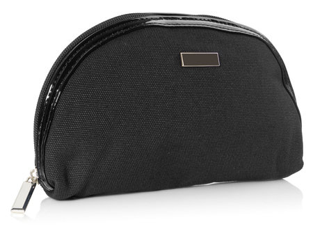 Women's beautician to store cosmetics. Purse for women made of black material, space for a logo. Fashionable object isolated on a white background with a slight reflection.の写真素材