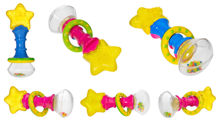 Baby rattle with a star shaped teether, multicolored hoop and rattling beads in a transparent container. Children's toy isolated on a white background.の写真素材