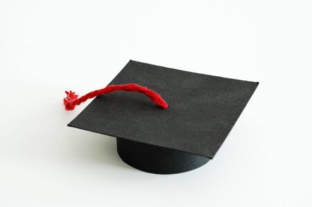 Graduation paper cap with a red tasselの写真素材