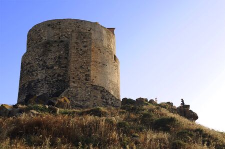 tourists taking pictures on tharros hill towerの写真素材