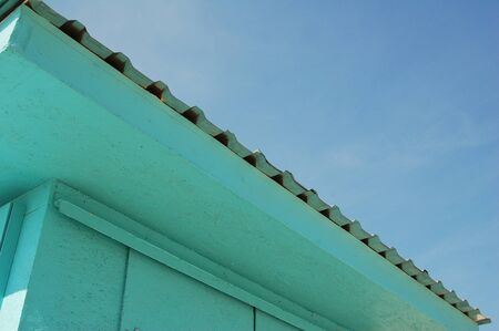 house roof against blue sky