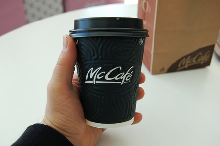 Kyiv, Ukraine, 09/30/2019. Hands holding coffee cup McCafe