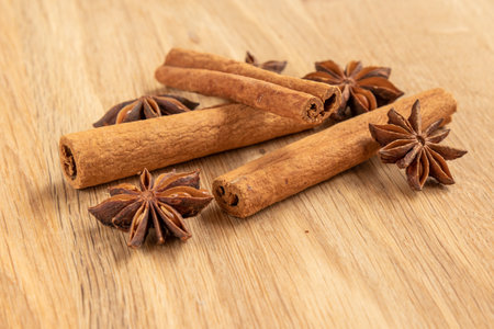 Cinnamon and Star Anise on wooden table, food background.