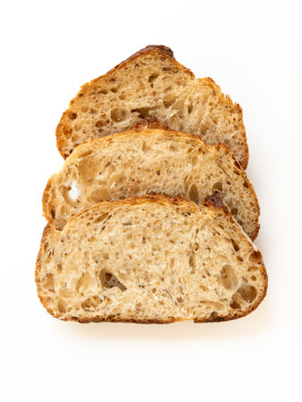 Sliced bread on white background top view. Fresh delicious homemade healthy bake. Bakery.