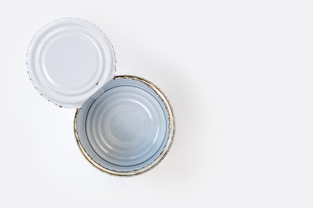 empty opened aluminum can isolated on white background, top view