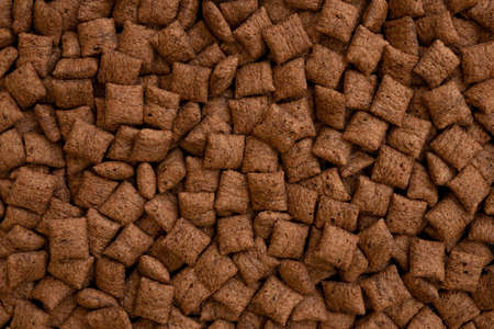 chocolate pillows background texture, brown choco cereal pads pattern, crispy corn flakes wallpaper,...