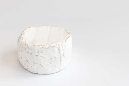 head of tasty camembert cheese isolated on white, brie type of cheese, french cheeseの写真素材