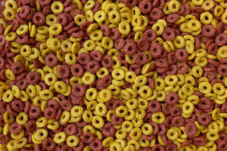 delicious cheerios colored oat cereal in large pile, cereal cheerios background, delicious and...