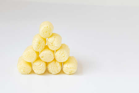 heap of sweet crunchy corn sticks or snacks with ampty space for text isolated on white backgroundの写真素材