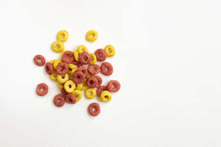heap of cereal rings isolated on white background, delicious and useful rings breakfast cereal, top view closeupの写真素材