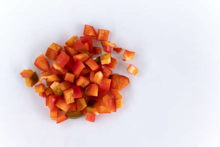 red chopped sweet bell pepper isolated on white background, top view, raw vegetables, harvest new of red peppersの写真素材