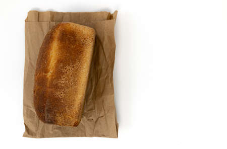 loaf of golden wheat bread brick isolated on white background, homemade baking, fresh whole grain...