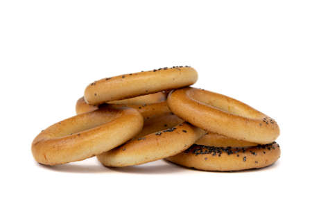 group of bagels with poppy seeds isolated on white background, side view, food bakery concept