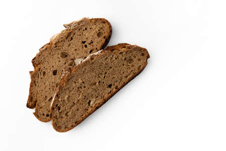two slices of rye bread on white background, top view, fresh delicious homemade healthy baking