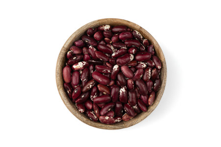 red kidney beans in wooden bowl isolated on white background, top view