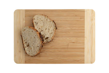 two slices wheat bread on wooden board with empty space for text isolated on white background, fresh...