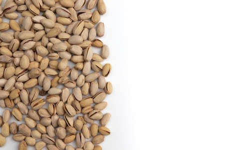 frame of pistachio with copy space for text isolated on white background, healthy snacks, pistachio nut with shellの写真素材