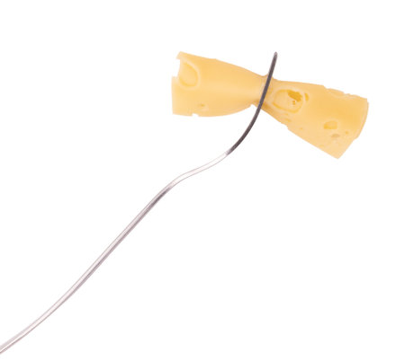 fork with slices of cheese isolated on white background, piece of appetizing cheese, delicious meat snacksの写真素材
