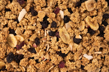 granola texture, muesli texture, top view, close up photo image on granola or muesli pile texture, cereal grain healthy food, can use for backgroundの写真素材