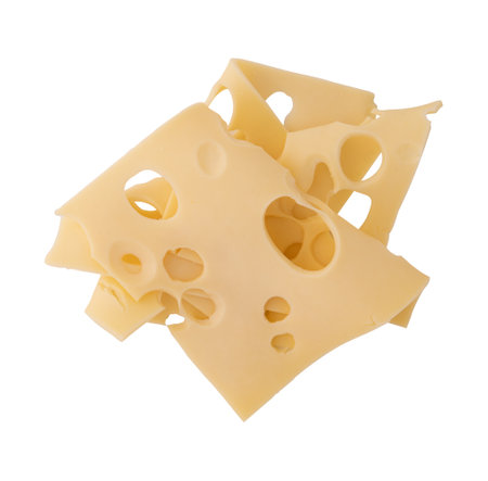 folded slices of cheese isolated on white background, pieces of sliced maasdam or emmental cheese laid out to create layoutの写真素材