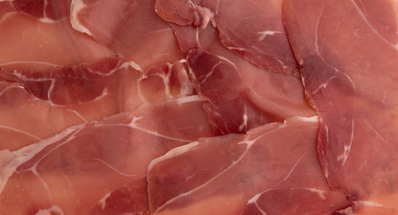 jamon serrano or iberico, spanish ham texture background, traditional prosciutto sliced, dry cured meat hamの写真素材