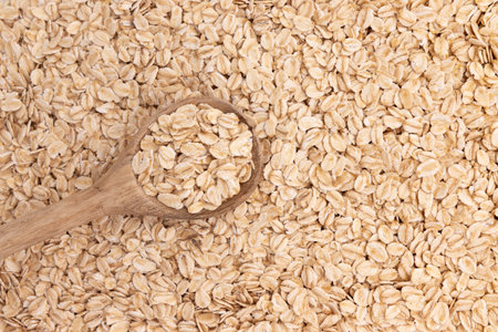 wooden spoon with cereal on background of oatmeal, instant cereal, healthy breakfast concept, food...