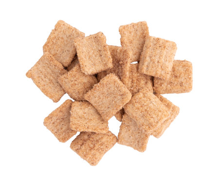 pile of crunchy granola, cinnamon toast crunch isolated on white background with clipping path, heap of flakes with cinnamonの写真素材