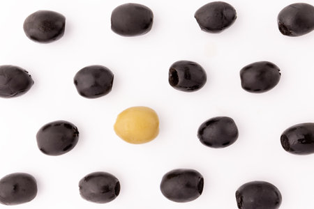 pattern of green and black olives isolated on white background, vegan foodの写真素材