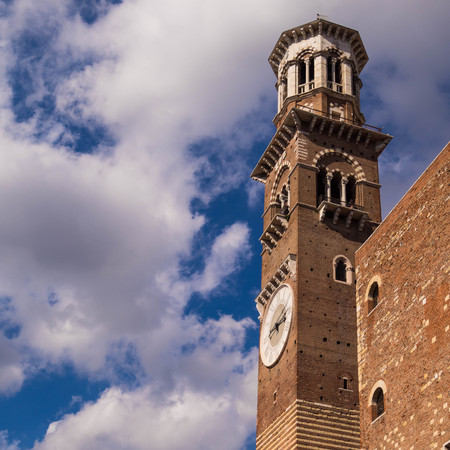 Lamberti tower in Verona Italy. Shooted in a september noon with blue sky and white cloudのeditorial素材