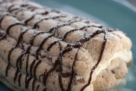 Swedish pastry called Budapest cake on turquoise plate.