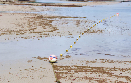 line yellow buoy floating on the sea