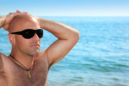 Good looking man on the beachの写真素材