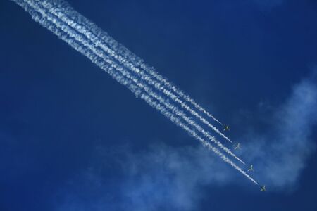 group of four airplanes making formationの写真素材