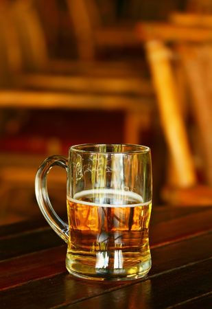 Glass of beer on the tableの写真素材