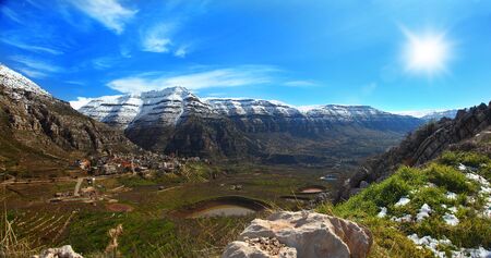 beautiful panoramic sping landscape with high mountainsの写真素材