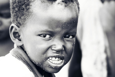 Portrait of African child expressing angryness. Editorial use onlyのeditorial素材