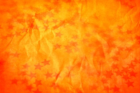 Old orange holiday wallpaper with a starsの写真素材