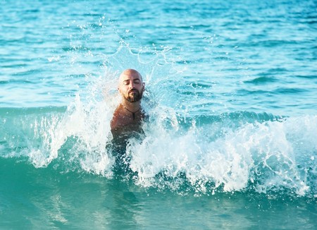 Guy playing on the wavesの写真素材