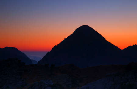 Dramatic sunset high up in the mountainsの写真素材