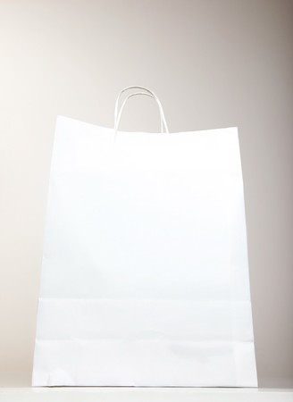 White Shopping Bag over gray background, studio shotの写真素材
