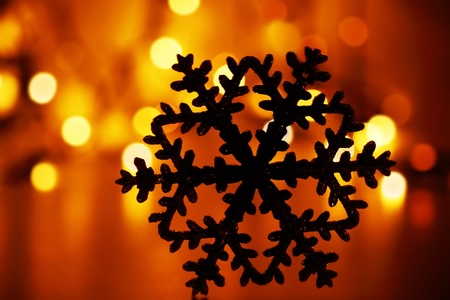 Red Christmas holiday background with tree decoration snowflake ornament and bokeh lightsの写真素材