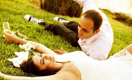 Happy new young family outdoor, wedding dayの写真素材