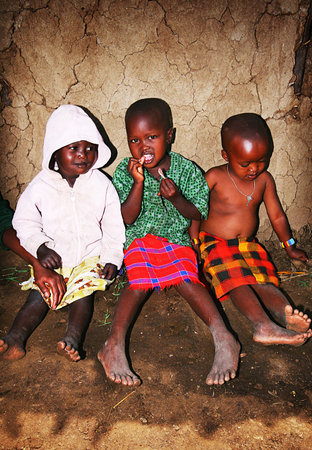 AFRICA, KENYA, MASAI MARA, NOVEMBER 12: portrait on an African  Kids of Masai Mara tribe village smiling to the camera, review of daily life of local people, near to Masai Mara National Park Reserve, November 12, 2008 Kenyaのeditorial素材
