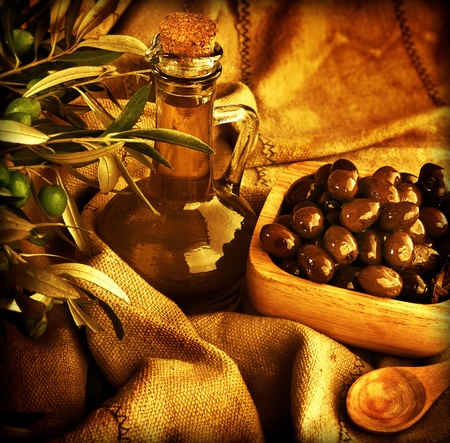 Grunge background, food still life, old style image of olives and olive oil, homemade traditional Mediterranean salad dressing, harvestの写真素材