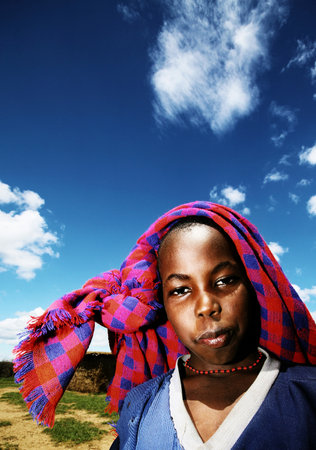 AFRICA, KENYA, MASAI MARA, NOVEMBER 12: portrait of a hungry African child of Masai Mara tribe village, review of daily kids life, orphan boy, Masai Mara National Park Reserve, November 12, 2008 Kenyaのeditorial素材