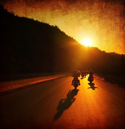 Motorcycle ride, people driving motorbikes, large group of bikers on the summer ride parade, moving on sunset street, summer travel, road trip, freedom lifestyle Motorcycle ride, people driving motorbikes, large group of bikers on the summer ride parade, moving on sunset street, summer travel, road trip, freedom lifestyle