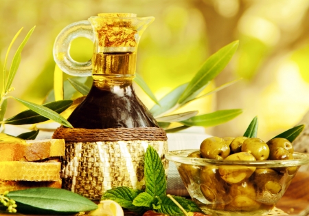 Olives still life, fresh food in garden of olive trees, farm land at countryside of Lebanon, homemade healthy olive oil and bread, harvest timeの写真素材